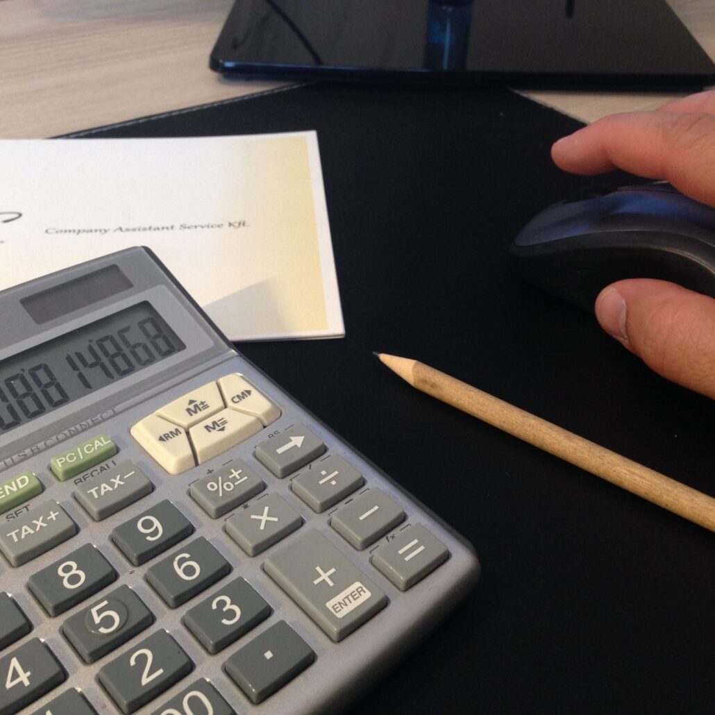 Calculator and Company Assistant documents representing local business tax calculation and tax optimization in Hungary